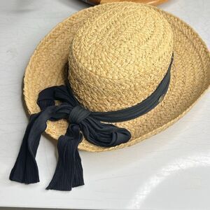 The SCALA collection  Classic Raffia Straw Sun Hat with a black ribbon band